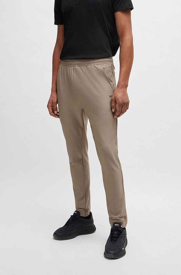 Tracksuit-bukser i stof med stræk og dekorativt, reflekterende logo, Lysebrun