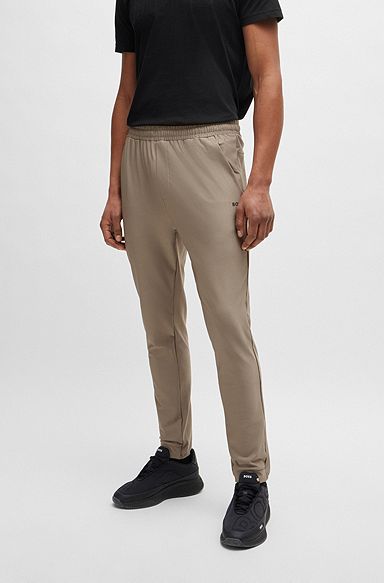 Pantaloni della tuta in tessuto elasticizzato con logo riflettente decorativo, Marrone chiaro