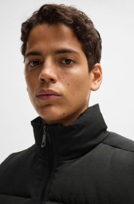 Water-repellent gilet with blue logo label, Black