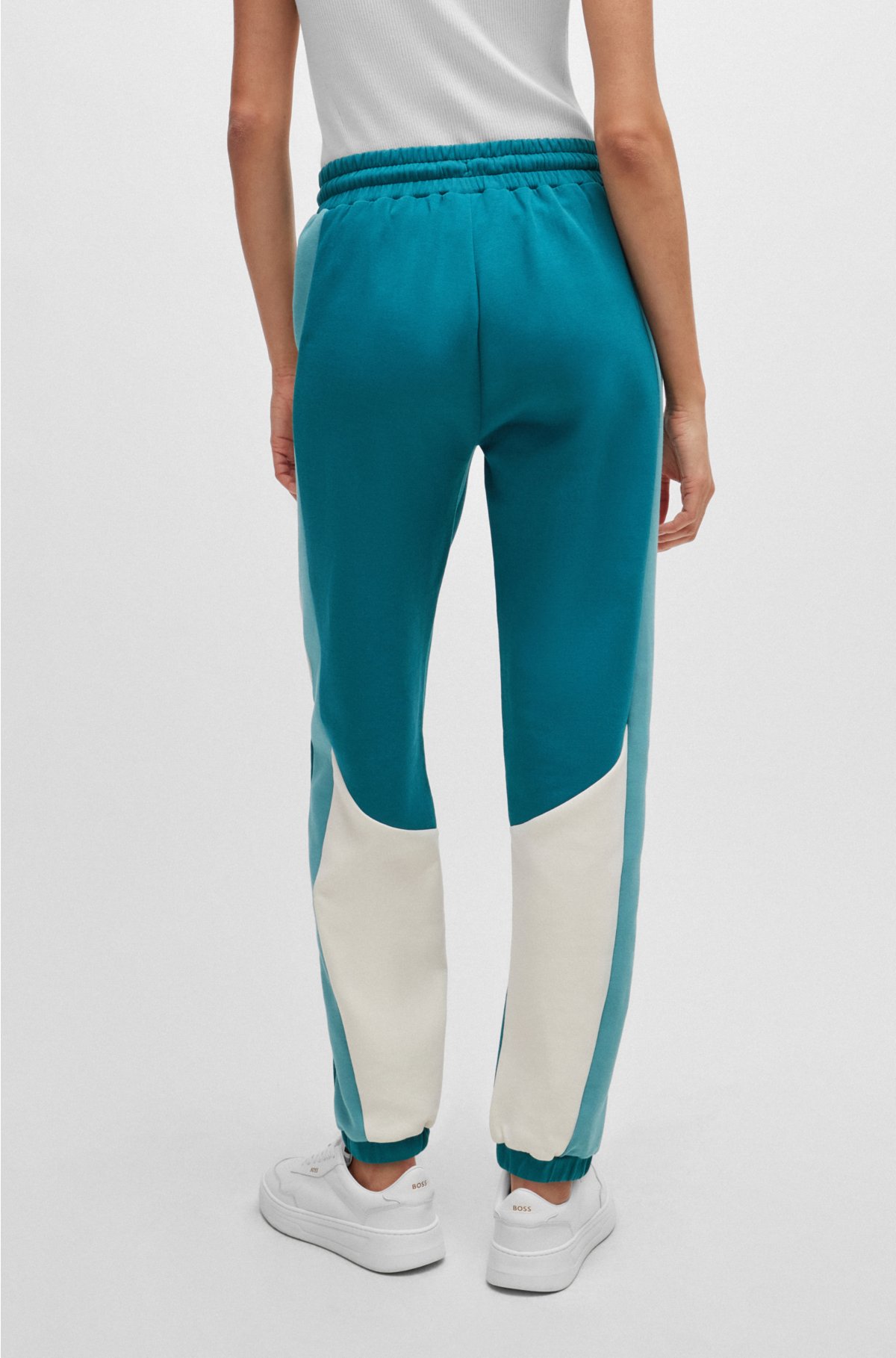 Baggy-fit tracksuit bottoms in stretch fabric, Petrol