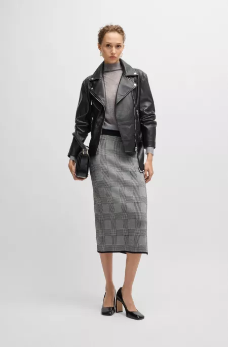 Veste en cuir avec ceinture et fermeture éclair asymétrique