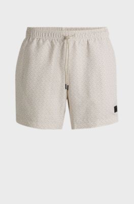 Micro-print swim shorts with logo badge, White