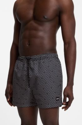 Printed swim shorts with logo badge, Black Patterned