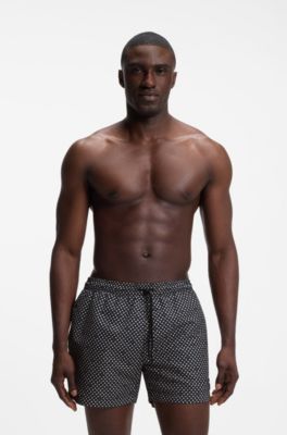 Printed swim shorts with logo badge, Black Patterned