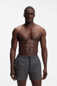 Printed swim shorts with logo badge, Black Patterned