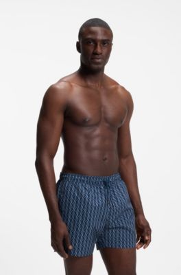 Printed swim shorts with logo badge, Blue Patterned