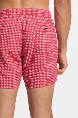 Printed swim shorts with logo badge, Red