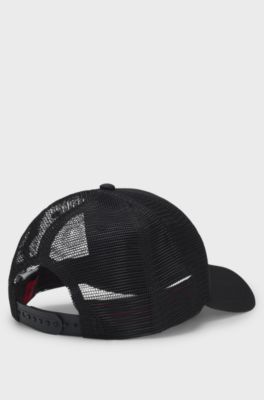 Twill trucker cap with red logo label, Black