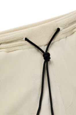 BOSS - Regular-fit shorts with double-monogram badge 