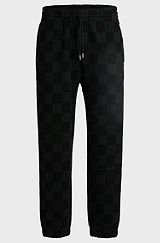 Loose-fit tracksuit bottoms with checkerboard print, Black