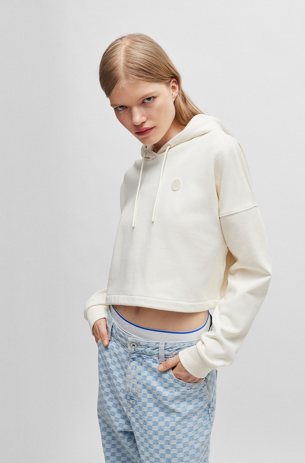 Cropped cotton-terry hoodie with Happy HUGO logo badge, Natural