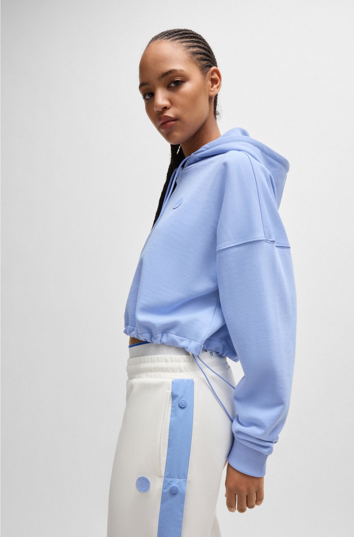 Cropped cotton-terry hoodie with Happy HUGO logo badge, Light Blue
