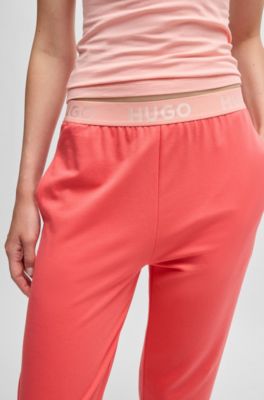 Pantaloni della tuta in misto cotone con elastico in vita con logo, Rosso chiaro
