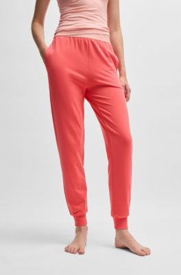 Pantaloni della tuta in misto cotone con elastico in vita con logo, Rosso chiaro