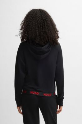 Hoodie i relaxed fit och logga i midjan, Svart