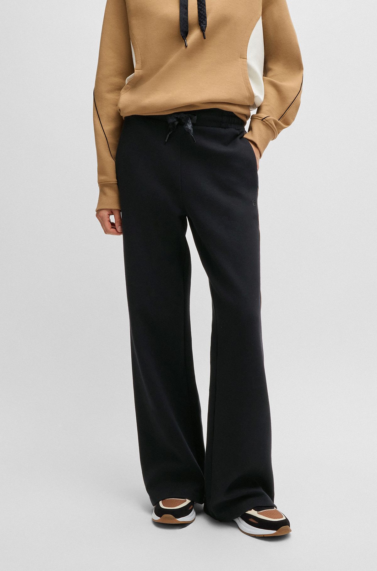 Tracksuit bottoms in a cotton blend with piped details, Black