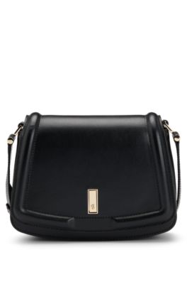 Leather saddle bag with signature hardware and monogram, Black