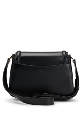 Leather saddle bag with signature hardware and monogram, Black