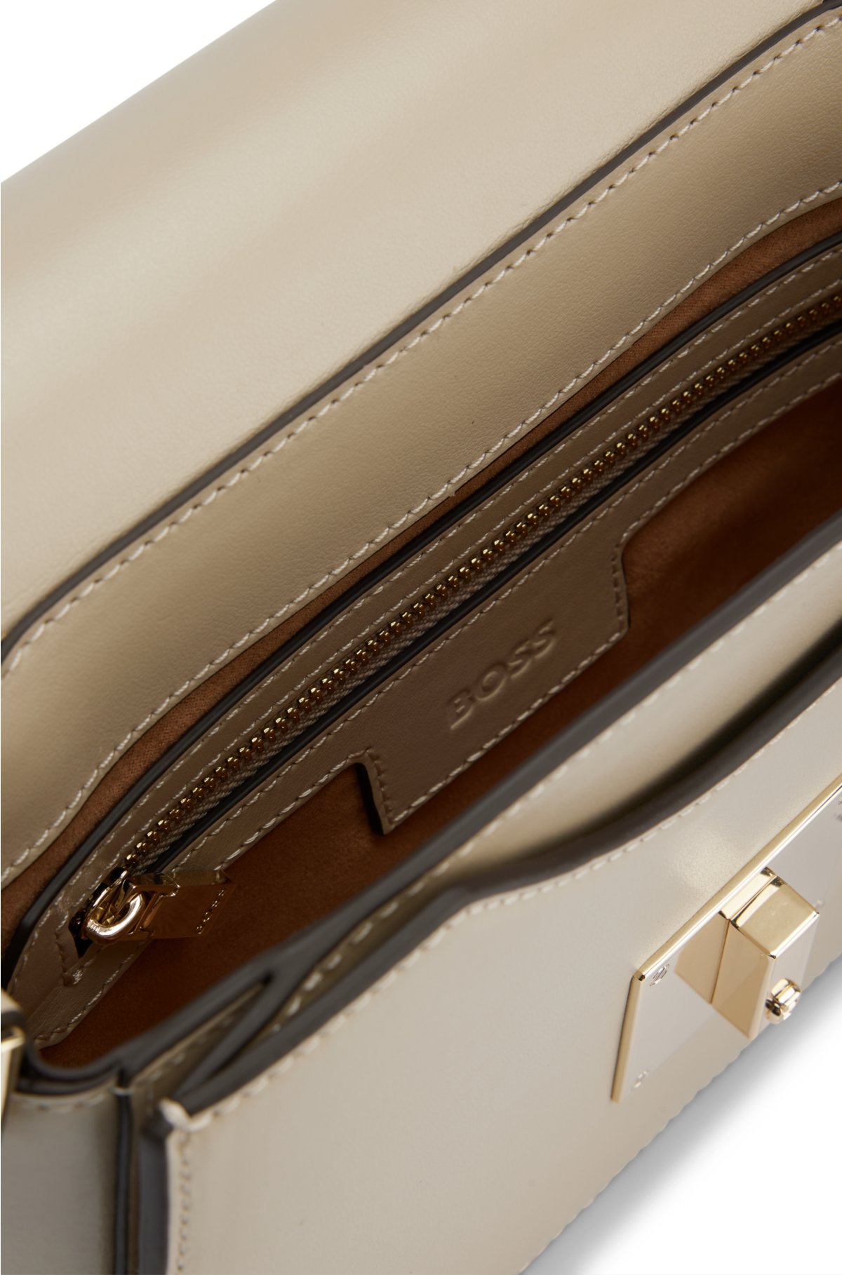 Leather saddle bag with signature hardware and monogram, Light Beige