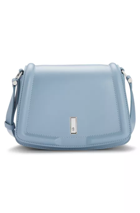 Leather saddle bag with signature hardware and monogram