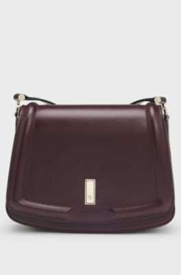 Leather saddle bag with signature hardware and monogram, Dark Red