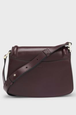 Leather saddle bag with signature hardware and monogram, Dark Red