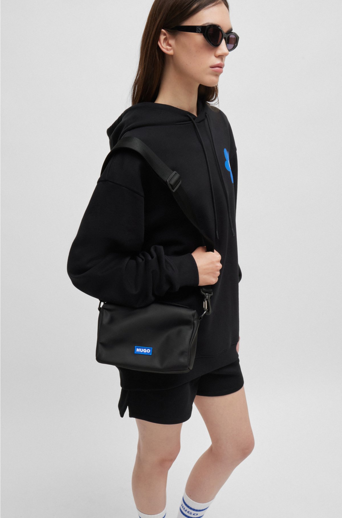 Crossbody bag in structured twill with blue logo trim, Black