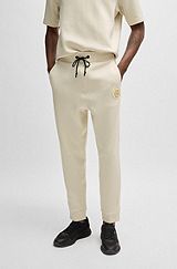 Regular-fit tracksuit bottoms with double-monogram badge, Natural