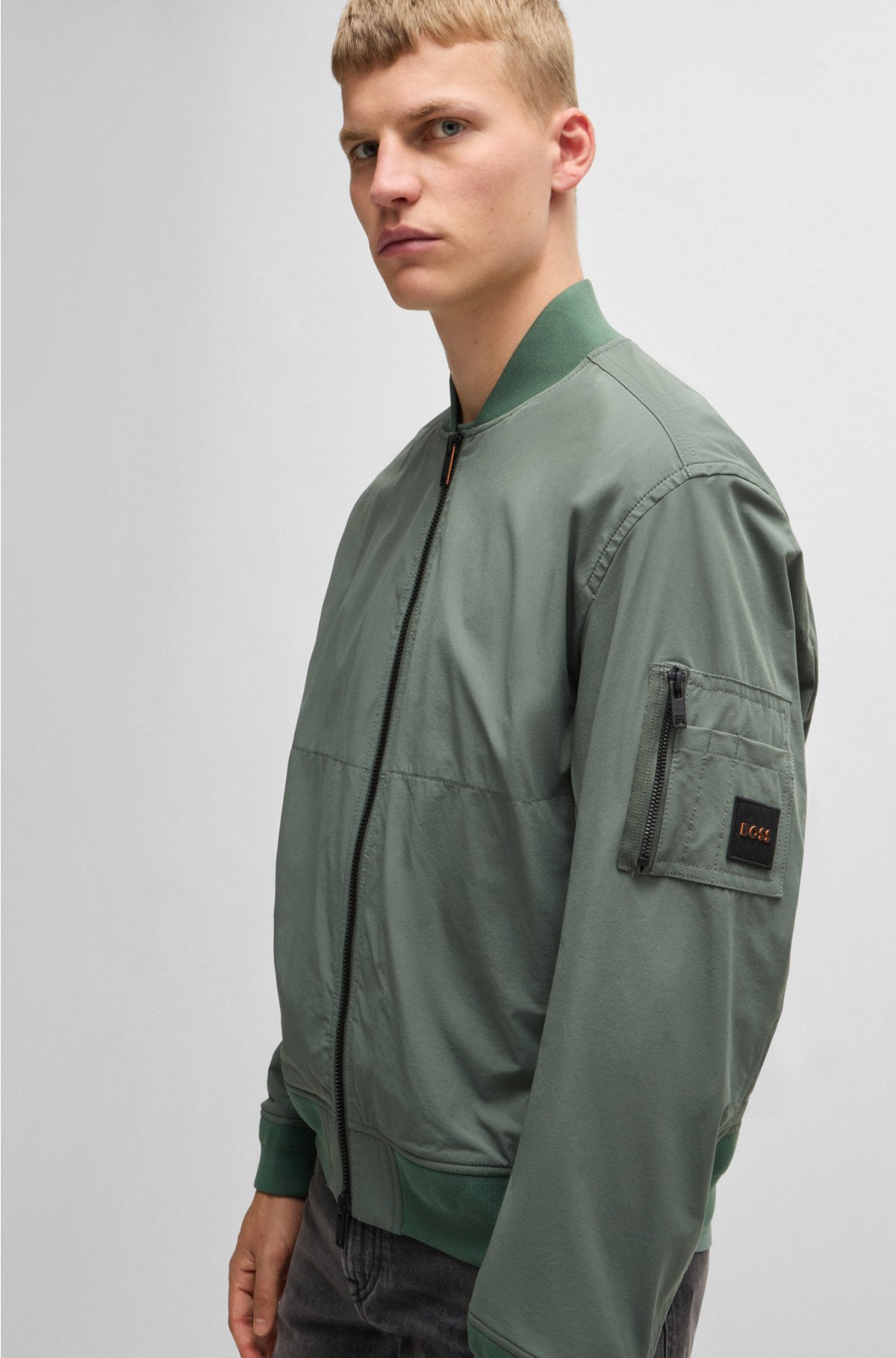 Water-repellent jacket with zipped sleeve pocket, Green