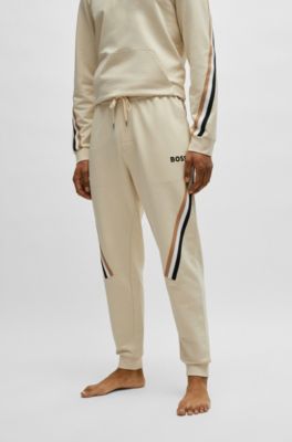 BOSS - Cotton-terry tracksuit bottoms with signature-stripe tape ...