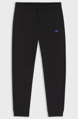 Cotton-terry tracksuit bottoms with logo patch, Black