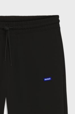 Cotton-terry tracksuit bottoms with logo patch, Black
