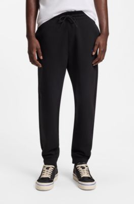 Cotton-terry tracksuit bottoms with logo patch, Black