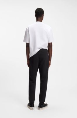 Cotton-terry tracksuit bottoms with logo patch, Black
