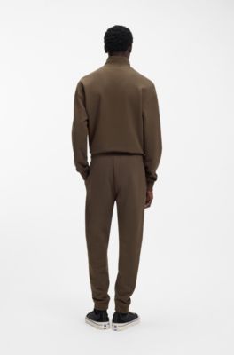 Jogginghose aus Baumwoll-Terry mit Logo-Aufn&auml;her, Dunkelbraun