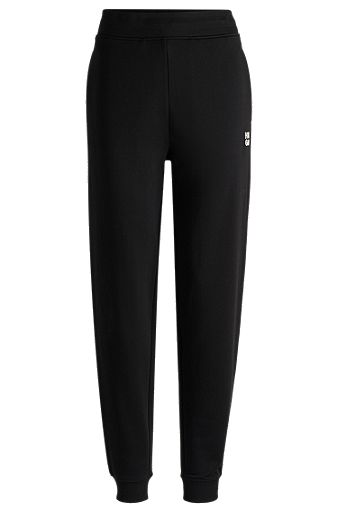 Cotton-terry tracksuit bottoms with stacked logo, Black
