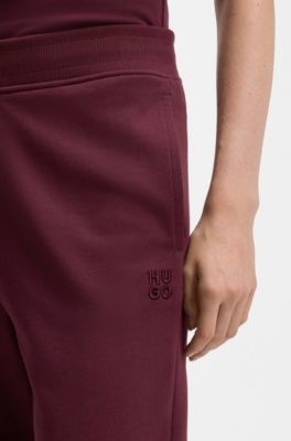 Cotton-terry tracksuit bottoms with embroidered logo, Bordeaux