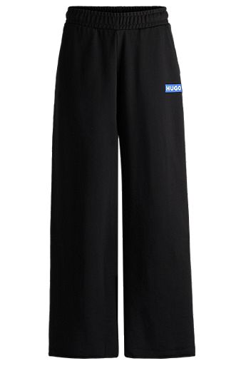 Relaxed-fit tracksuit bottoms with logo print, Black