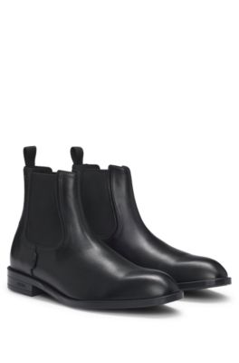 Leather Chelsea boots with stitching details and signature accents, Black