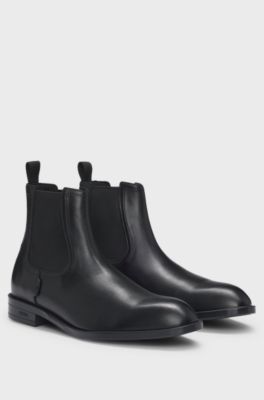 Leather Chelsea boots with stitching details and signature accents, Black