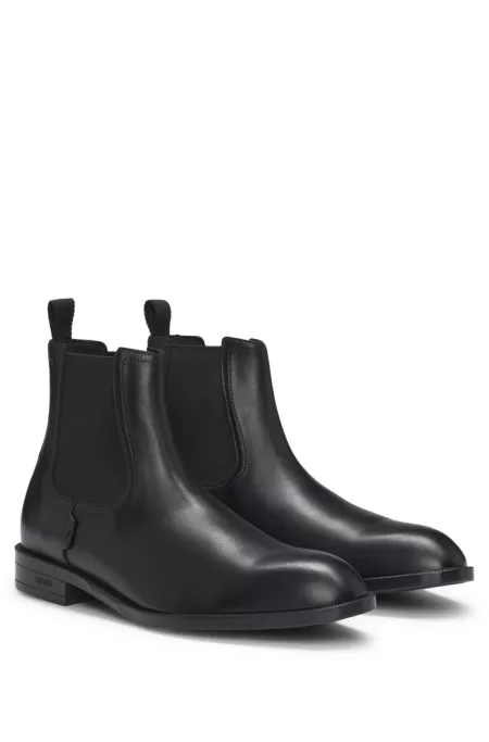 Leather Chelsea boots with stitching details and signature accents