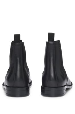 Leather Chelsea boots with stitching details and signature accents, Black