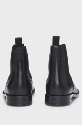Leather Chelsea boots with stitching details and signature accents, Black