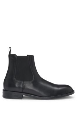 Leather Chelsea boots with stitching details and signature accents, Black