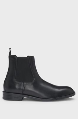 Leather Chelsea boots with stitching details and signature accents, Black