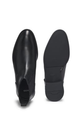 Leather Chelsea boots with stitching details and signature accents, Black