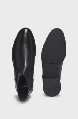 Leather Chelsea boots with stitching details and signature accents, Black