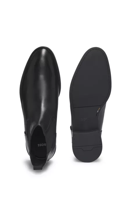 Leather Chelsea boots with stitching details and signature accents