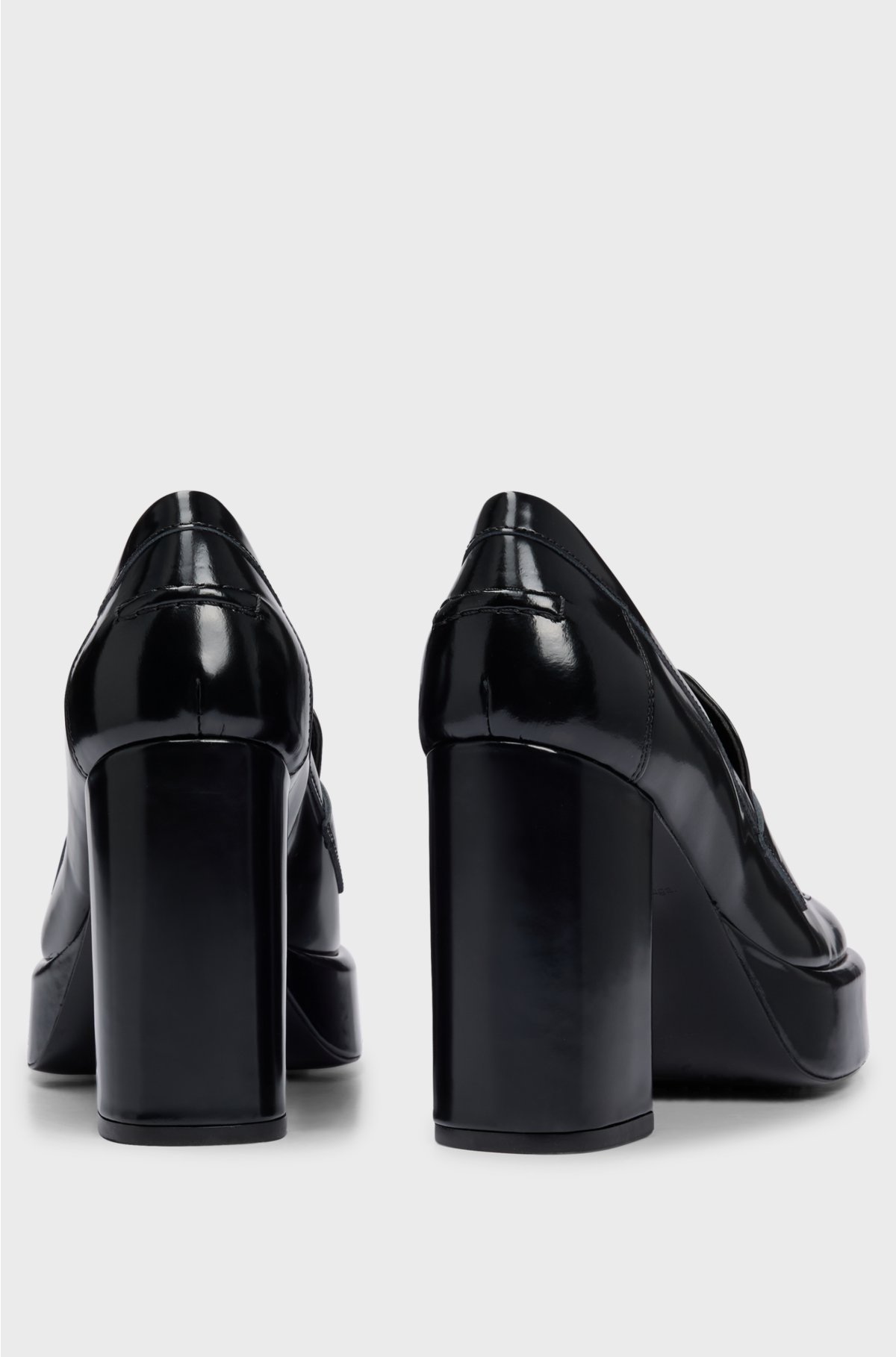 Platform loafers in leather with stacked-logo trim, Black