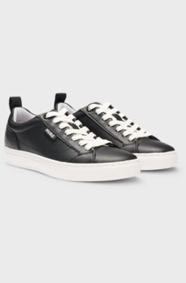 Cupsole trainers in faux leather with logo flag, Black
